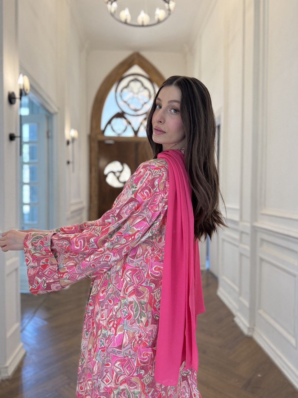 Woman wearing a hot pink Summer Pink Abaya by F.Lounge Dubai