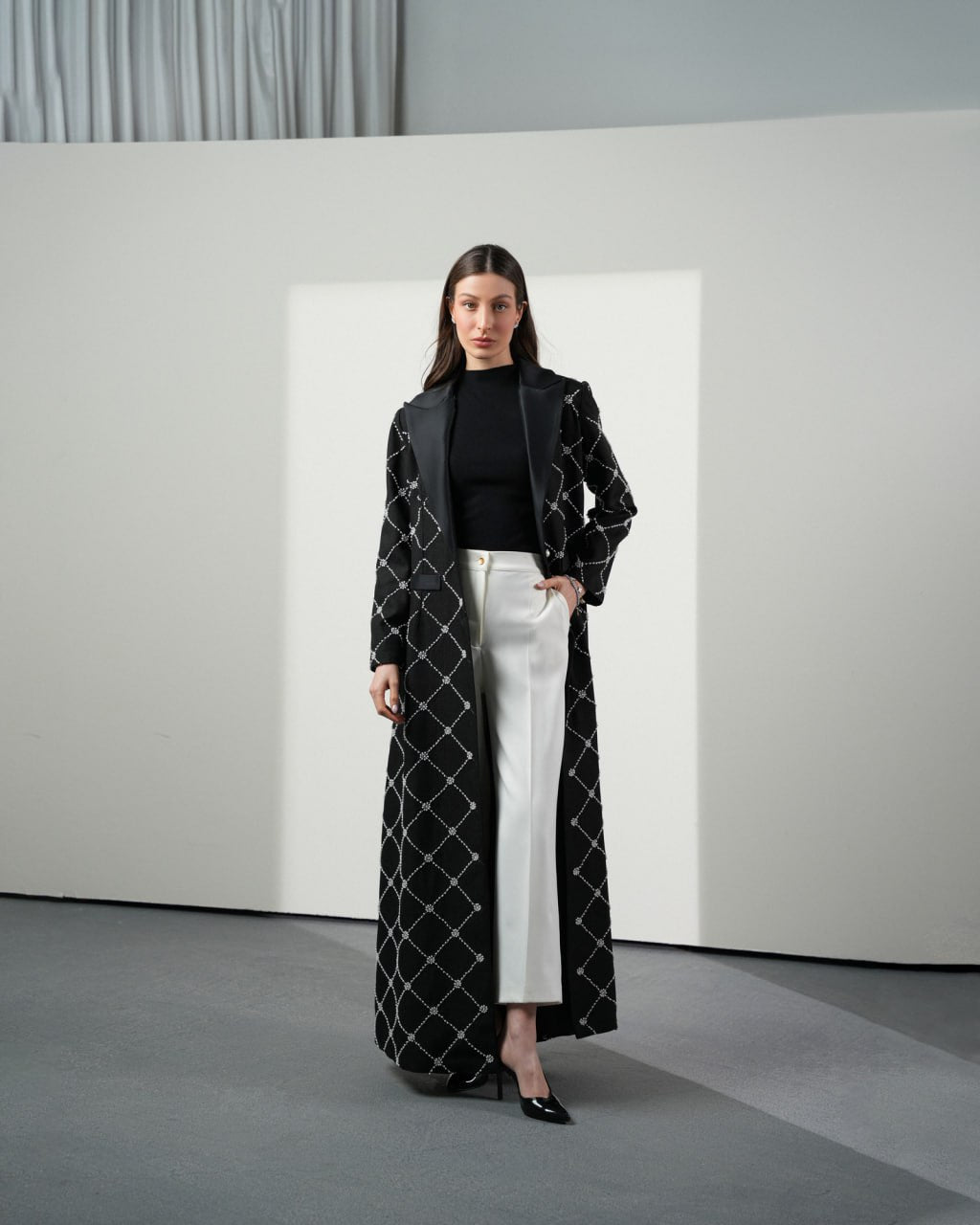 Elegant black abaya with soft pearl embellishments from F.Lounge Dubai